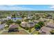 Expansive aerial view of a residential community featuring well-maintained homes and scenic ponds with lush greenery at 2637 Yukon Cliff Dr, Ruskin, FL 33570