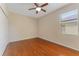 Cozy bedroom showcasing wood floors, a window and a closet at 2637 Yukon Cliff Dr, Ruskin, FL 33570