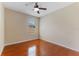 An empty bedroom features hardwood floors, a ceiling fan, and a window at 2637 Yukon Cliff Dr, Ruskin, FL 33570
