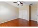 A light-filled bedroom with hardwood floors and a spacious closet at 2637 Yukon Cliff Dr, Ruskin, FL 33570