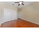 Bedroom featuring hardwood floors, closet, and access door at 2637 Yukon Cliff Dr, Ruskin, FL 33570