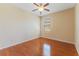 Light-filled bedroom showcases wood floors, and a window at 2637 Yukon Cliff Dr, Ruskin, FL 33570