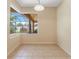 Bright dining area with tile floors and large window for natural light at 2637 Yukon Cliff Dr, Ruskin, FL 33570