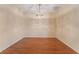 Charming dining room with hardwood floors and a lovely chandelier at 2637 Yukon Cliff Dr, Ruskin, FL 33570