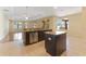 Open kitchen with island, stainless steel appliances and tile flooring at 2637 Yukon Cliff Dr, Ruskin, FL 33570