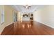 Spacious living room flows into kitchen featuring wood floors and recessed lighting at 2637 Yukon Cliff Dr, Ruskin, FL 33570