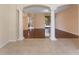 Spacious living room with beautiful wood floors, decorative columns and tiled entryway at 2637 Yukon Cliff Dr, Ruskin, FL 33570