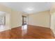 Bright living room featuring hardwood floors, a sliding glass door to the patio, and easy access to kitchen at 2637 Yukon Cliff Dr, Ruskin, FL 33570