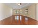 Bright living room featuring wood floors, fan, recessed lighting, and large windows at 2637 Yukon Cliff Dr, Ruskin, FL 33570