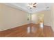 Spacious bedroom featuring tray ceilings, hardwood floors and neutral paint at 2637 Yukon Cliff Dr, Ruskin, FL 33570