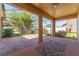 Spacious screened lanai with brick accents and a view of the landscaped yard at 2637 Yukon Cliff Dr, Ruskin, FL 33570