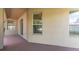 The outdoor covered patio features direct access to the home's interior through sliding glass doors at 2637 Yukon Cliff Dr, Ruskin, FL 33570