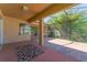 The covered patio features brick pavers and access to the backyard at 2637 Yukon Cliff Dr, Ruskin, FL 33570