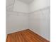 Spacious walk-in closet with wire shelving for storage and hardwood floors at 2637 Yukon Cliff Dr, Ruskin, FL 33570
