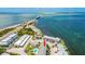Townhome aerial view showcasing a community near ocean waters with waterfront access at 2643 St Josephs W Dr, Dunedin, FL 34698
