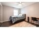 Charming bedroom, light and airy, offers a serene space with a comfortable bed and desk area for work or relaxation at 2643 St Josephs W Dr, Dunedin, FL 34698