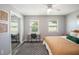 Bright bedroom with a desk, complemented by the sliding mirrored closet for added style and functionality at 2643 St Josephs W Dr, Dunedin, FL 34698
