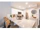 Bright kitchen features stainless steel appliances, white cabinetry and a spacious granite countertop at 2643 St Josephs W Dr, Dunedin, FL 34698