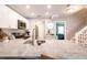 Modern kitchen featuring stainless steel appliances, white cabinetry, and granite countertops at 2643 St Josephs W Dr, Dunedin, FL 34698