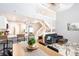 Open-concept living room and kitchen with modern finishes, staircase, and lofted ceiling at 2643 St Josephs W Dr, Dunedin, FL 34698
