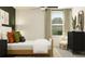 Bright bedroom with a comfortable bed, natural light streaming through the window, and chic decor at 2713 Bryce Ravine Ave, Plant City, FL 33563