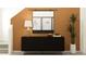 Modern entryway featuring black cabinet, stylish decor, and a large mirror for a sophisticated touch at 2713 Bryce Ravine Ave, Plant City, FL 33563