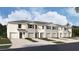 New townhome with neutral exterior, landscaping, and single-car garage at 31326 Ancient Sage Rd, Wesley Chapel, FL 33545