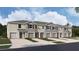 New townhome with neutral exterior, landscaping, and single-car garage at 31326 Ancient Sage Rd, Wesley Chapel, FL 33545
