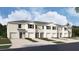 New townhome with neutral exterior, landscaping, and single-car garage at 31326 Ancient Sage Rd, Wesley Chapel, FL 33545