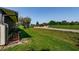 Lush backyard featuring green lawn and scenic views of the golf course at 3174 Eagles Landing W Cir # 58, Clearwater, FL 33761