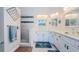 Bright bathroom with dual sinks, ample counter space, and a tiled walk-in shower at 3174 Eagles Landing W Cir # 58, Clearwater, FL 33761