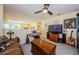 Bonus room with musical instruments, a leather sofa, and neutral carpet throughout at 3174 Eagles Landing W Cir # 58, Clearwater, FL 33761