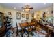 Classic dining room with wood table, ceiling fan, and windows letting in natural light at 3174 Eagles Landing W Cir # 58, Clearwater, FL 33761