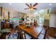 Open concept dining room with wood floors and views into the living and entry areas at 3174 Eagles Landing W Cir # 58, Clearwater, FL 33761