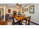 Inviting dining room with wood floors, a ceiling fan, and comfortable seating for Gathering and guests at 3174 Eagles Landing W Cir # 58, Clearwater, FL 33761