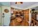 Eat-in-kitchen and breakfast nook area shows stainless appliances and wood cabinets at 3174 Eagles Landing W Cir # 58, Clearwater, FL 33761