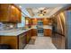 Well-equipped kitchen with stainless steel appliances, granite countertops, and tile backsplash at 3174 Eagles Landing W Cir # 58, Clearwater, FL 33761