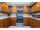 Modern kitchen featuring stainless steel appliances, granite countertops, and ample cabinet space at 3174 Eagles Landing W Cir # 58, Clearwater, FL 33761