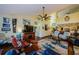 Cozy living room with wood floors, ceiling fan, and eclectic decor throughout at 3174 Eagles Landing W Cir # 58, Clearwater, FL 33761