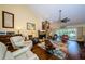 Bright living room boasts a stone fireplace, comfortable seating, and sliding glass doors to the pool at 3174 Eagles Landing W Cir # 58, Clearwater, FL 33761