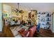 Spacious living room with a stone fireplace, high ceilings, and hardwood floors at 3174 Eagles Landing W Cir # 58, Clearwater, FL 33761