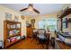 This home office offers great natural light, wooden floors, and ample shelf space for storage at 3174 Eagles Landing W Cir # 58, Clearwater, FL 33761