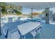 Relaxing outdoor space with tables, chairs, swimming pool, and hot tub offering a community gathering spot at 3174 Eagles Landing W Cir # 58, Clearwater, FL 33761
