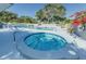 Community pool and hot tub area with lounge chairs, creating a perfect space for relaxation and recreation at 3174 Eagles Landing W Cir # 58, Clearwater, FL 33761