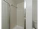 Bathroom featuring shower with glass door and ceramic tile wall at 3505 Tarpon Woods Blvd # N405, Palm Harbor, FL 34685