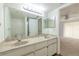 Bathroom featuring double sink vanity with marble top and mirror at 3505 Tarpon Woods Blvd # N405, Palm Harbor, FL 34685