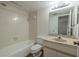 Bathroom featuring tile flooring, sink with granite vanity, and shower/tub combination at 3505 Tarpon Woods Blvd # N405, Palm Harbor, FL 34685