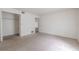 Large bedroom with closet, neutral carpeting, and view of the hallway at 3505 Tarpon Woods Blvd # N405, Palm Harbor, FL 34685