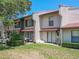 Charming condo featuring a well-manicured lawn, landscaping, and patio at 3505 Tarpon Woods Blvd # N405, Palm Harbor, FL 34685