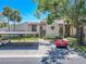 Well-maintained townhome complex featuring covered parking, lush greenery, and inviting entrances at 3505 Tarpon Woods Blvd # N405, Palm Harbor, FL 34685